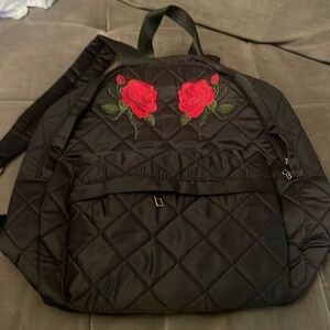 Black backpack with red roses, never used. Bundle 4 a deal.
